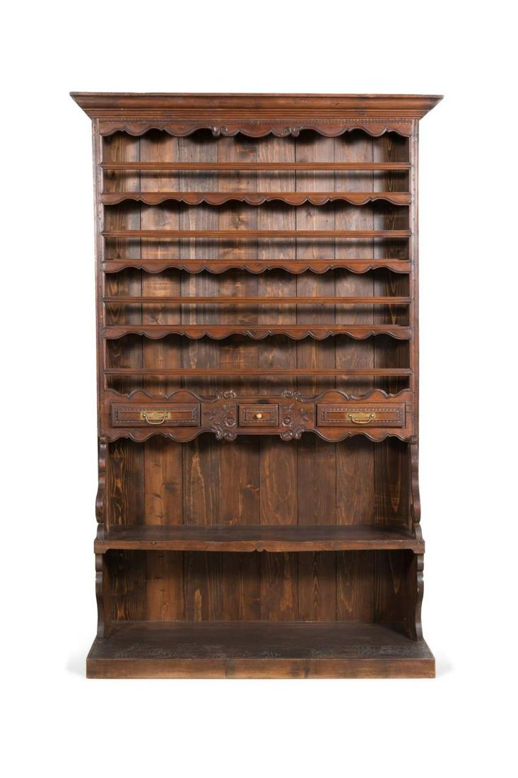 FRENCH PROVINCIAL STYLE CARVED WOOD CUPBOARD: French Louis XV Provincial style oak vaisselier or cupboard, 19th century and later, having a molded cornice over four plate racks, three small drawers, a shelf flanked by "S" curves and rising on a r