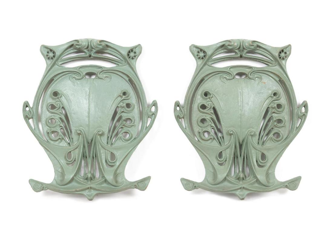 PR PARIS METRO RE-STRIKE BRONZE BALUSTRADE PLAQUES: Pair of re-strike bronze Paris Metro balustrade plaques after Hector Guimard (French 1867-1942), each of oval form with sinuous pierced flowers terminating to stylized "M"s for Metro at the bottom. Pr