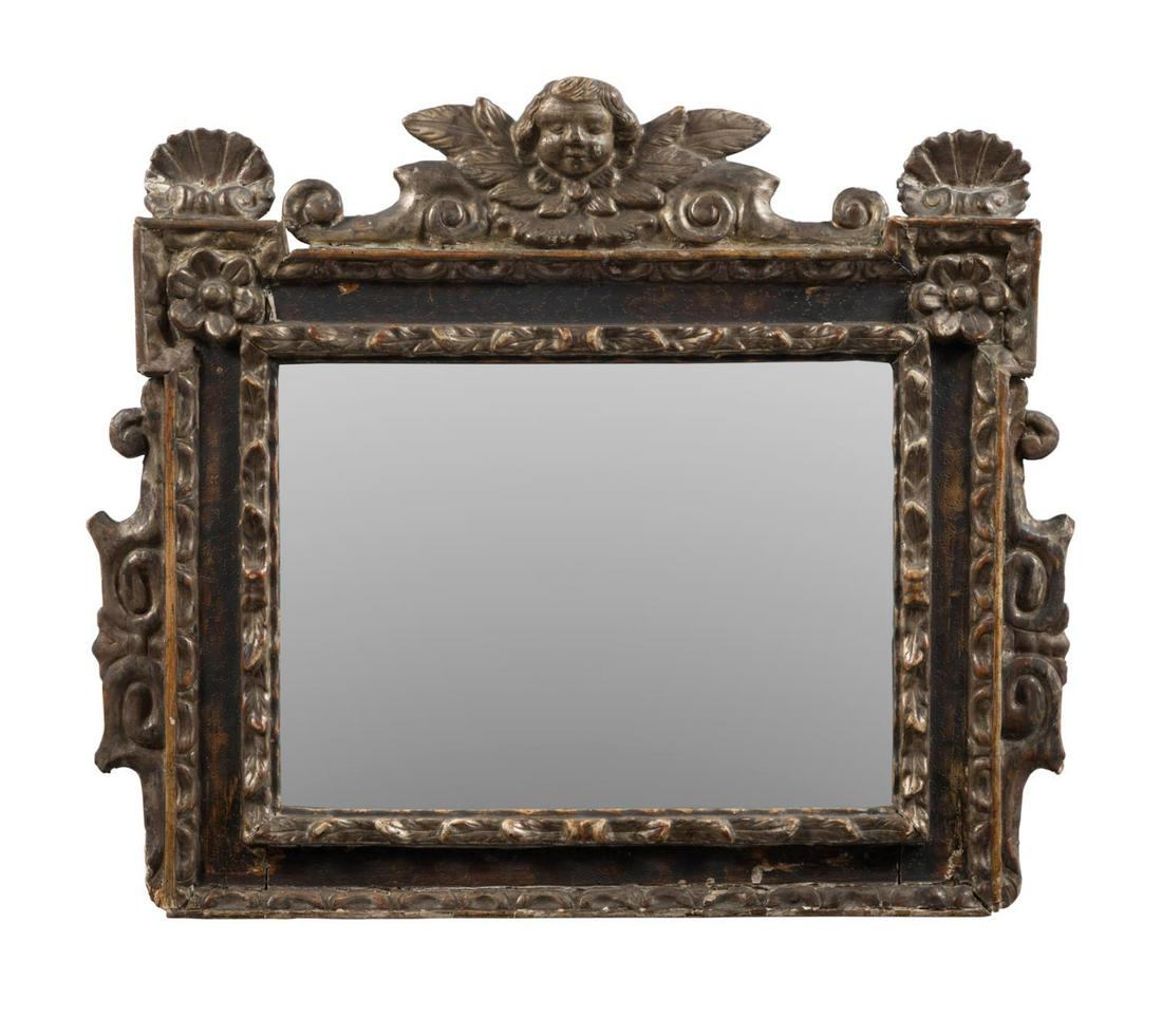 CONTINENTAL BAROQUE STYLE GILTWOOD CHERUB MIRROR: Continental giltwood and gesso mirror in the Baroque taste, 19th/20th century, having a cherub's head crest flanked by scallop shells, scrolled foliate detail, and containing a mirrored plate with wav