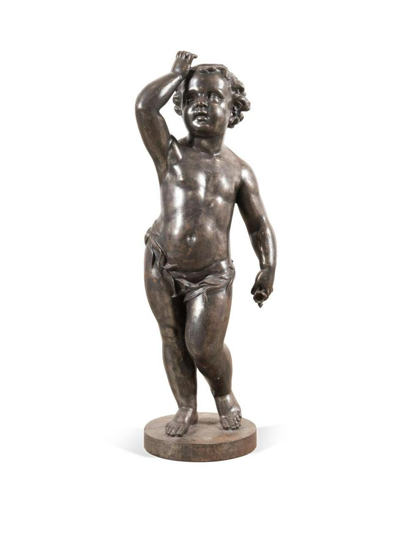19TH C. CAST IRON PLAYFUL BOY FOUNTAIN FIGURE: Continental cast iron fountain figure, 19th century, modeled as a playful boy, on circular plinth base, apparently unmarked. Approximate dimensions: h. 38", w. 15", d. 11".