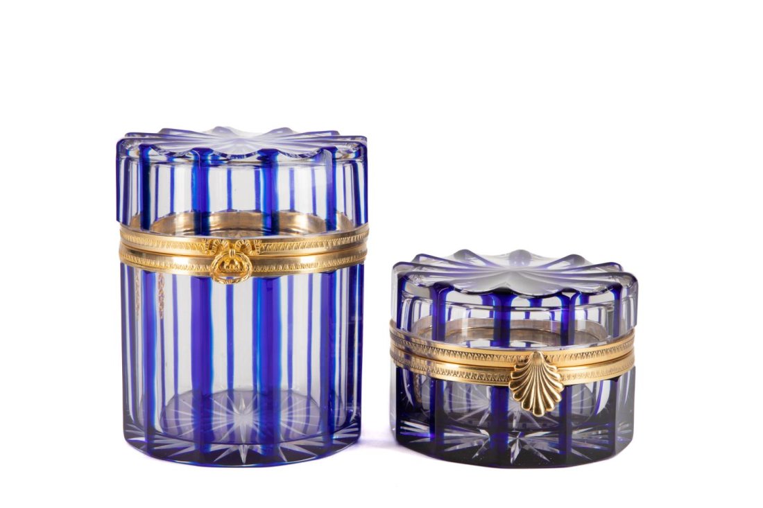 TWO COBALT CUT TO CLEAR BOXES, CRISTAL BENITO: Group of two cobalt cut to clear ormolu mounted fluted crystal covered boxes or caskets comprising, a Cristal Benito (French 1952) box with scallop shell latch, and an attributed Cristal Benito box wi