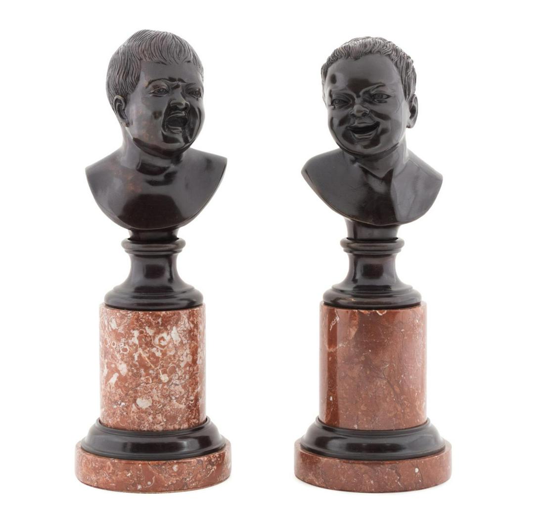 PR BRONZE BUSTS IN THE MANNER OF MESSERSCHMIDT: Pair of bronze busts of emotional babies in the manner of Franz Xaver Messerschmidt (Austrian 1736-1783), early 20th century, depicting one child laughing and one crying, each rising on a rouge marble