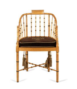 BAKER FAUX BAMBOO ARMCHAIR & MONOGRAMMED CUSHION: Baker Furniture faux bamboo wooden armchair in the Regency taste with caned seat and monogrammed cushion, marked to the underside of the frame. Approximate dimensions: h. 35. 75", w. 19", d. 21".