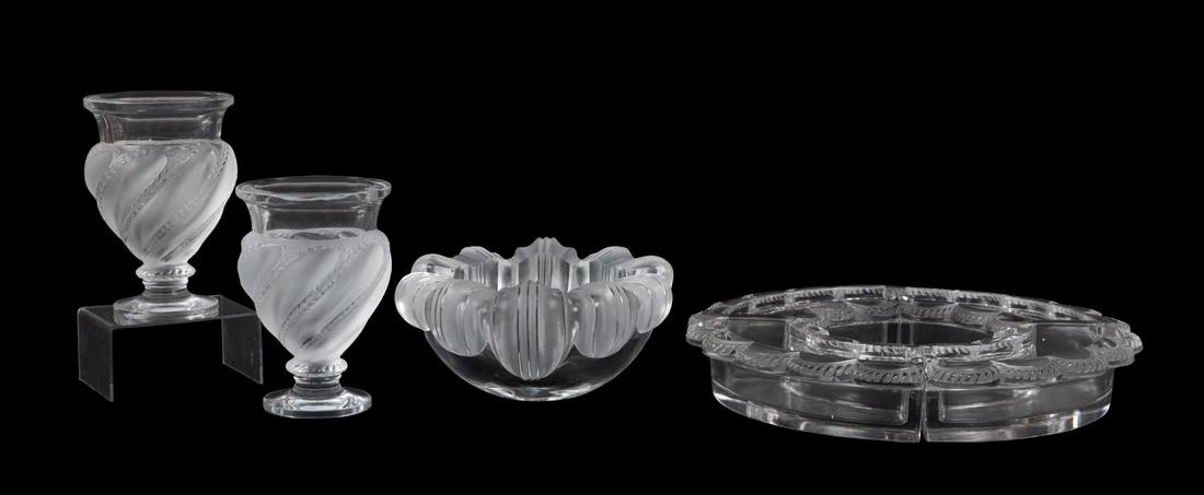 7PCS LALIQUE CRYSTAL TABLE ACCESSORIES: Seven pieces of Lalique crystal table accessories comprising, one "Athena" bowl, two "Ermenoville" small flower vases, and a four piece "Festons" centerpiece, all with etched Lalique France marks to u