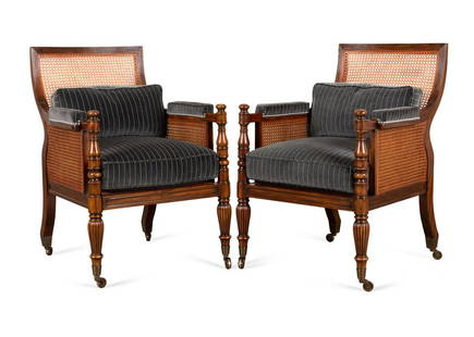 PAIR THEODORE ALEXANDER "REGENCY" CHAIRS: Pair of Theodore Alexander, Althorp Living History collection mahogany "Regency" bergere library armchairs, each having a caned back, seat, and side panels, loose seat cushion and accent pillow, turne