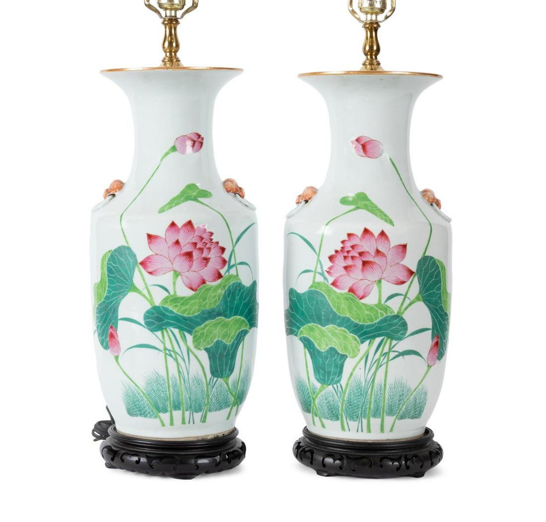 PAIR CHINESE FAMILLE ROSE VASES MOUNTED AS LAMPS: Pair of Chinese Famille Rose porcelain baluster form vases, now mounted as lamps, each having applied lion head handles, lotus pond decoration, and red and black calligraphy characters, not examined o