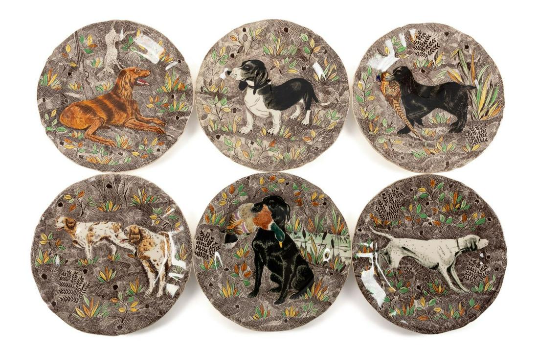 SIX GIEN "RAMBOUILLET" HUNTING DOG DESSERT PLATES: Set of six Faience De Gien (French 1821), "Rambouillet" hunting dog themed dessert plates designed by Jean Bertholle (French 1906-1996), depicting various canines in naturalistic settings, each marked