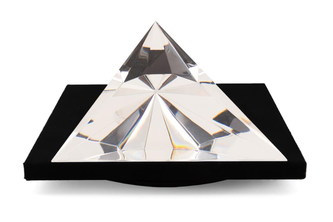 CHRISTOPHER RIES SCULPTURE, "POINT OF VIEW", 1998: Christopher Ries (American b. 1952), 'Point of View', optical glass sculpture, signed and dated 3/4/98, to underside, created with flat and faceted planes, resting on a black upholstered turntable. Ap