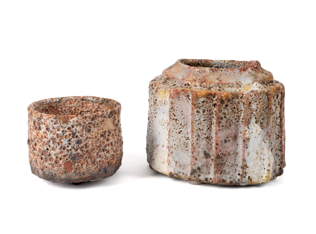 TWO HANS VANGSO STUDIO POTTERY VESSELS: Two Hans Vangso (Danish b. 1950), Studio Pottery vessels comprising, an oval vase or jar with linen fold side having crawling shino glaze in cream, peach and pink and a tea bowl in conforming glaze, b