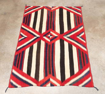 NAVAJO THIRD PHASE CHIEF'S STYLE BLANKET, 7 X 5: Navajo (Dine) hand woven wool Third Phase Chief's style blanket, 1930s, featuring a classic third phase design with nine serrated or hooked diamonds in blue cream and red on a brown and cream striped