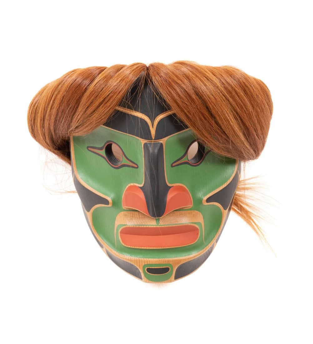 STEVE SMITH CARVED WOOD FIRST NATIONS SPIRIT MASK: Steve Smith, Dlaâ€™kwagila (Canadian / First Nations, b. 1968), Pacific Northwest carved wood black, green, and red spirit mask with horse hair, having a prominent nose and a closed mouth, signed