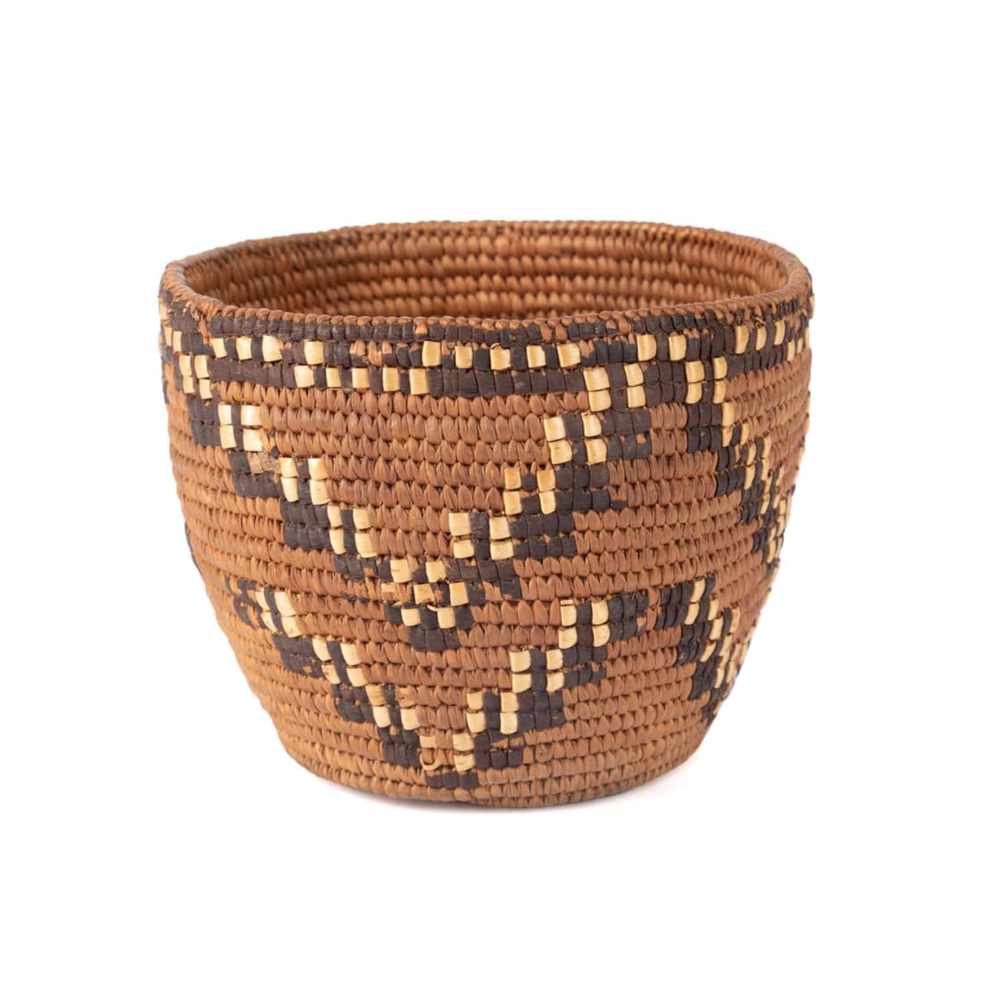THOMPSON RIVER SALISH COILED BASKET, CA 1900: Thompson River Salish peoples basket, circa 1900, tightly coiled in cedar, grasses, spruce root and cherry bark with a whipstitch rim, the exterior of the basket having a tonal multi-color repeating z