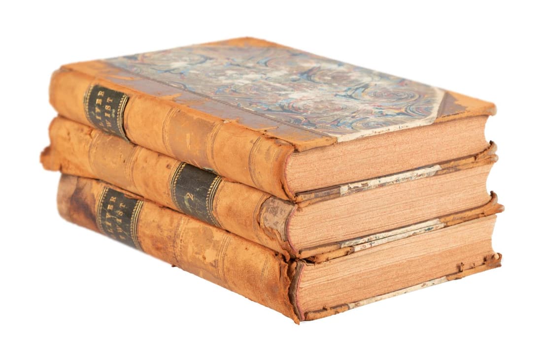 DICKENS, 3 VOL LEATHER BOUND, OLIVER TWIST: 3 vol set of Oliver Twist by Charles Dickens with illustrations by George Cruikshank, published in 1838 by Richard Bentley, bound in tan leather with marbled boards on each volume. Approximate measure