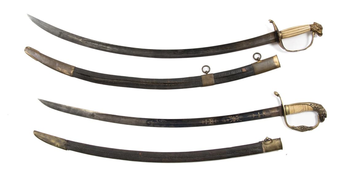 TWO U. S. EAGLE HEAD BONE GRIP CURVED SWORDS: Two US eagle head bone grip curved swords, 1812-1830, both having etched patriotic symbolism with parcel gilt to blade, one marked warranted, the other marked Solingen, (Germany). Approximate measurem