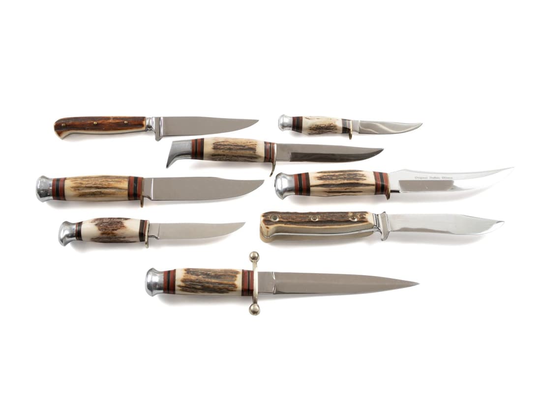 EIGHT NEW STAG HANDLED LINDER KNIVES: Eight different unused stag handled hunting knives with thumb guards, six are Linder-Messer and two are Linder- Rehwappen, types included are a dagger, five straight blades, a buffalo skinner, and a d