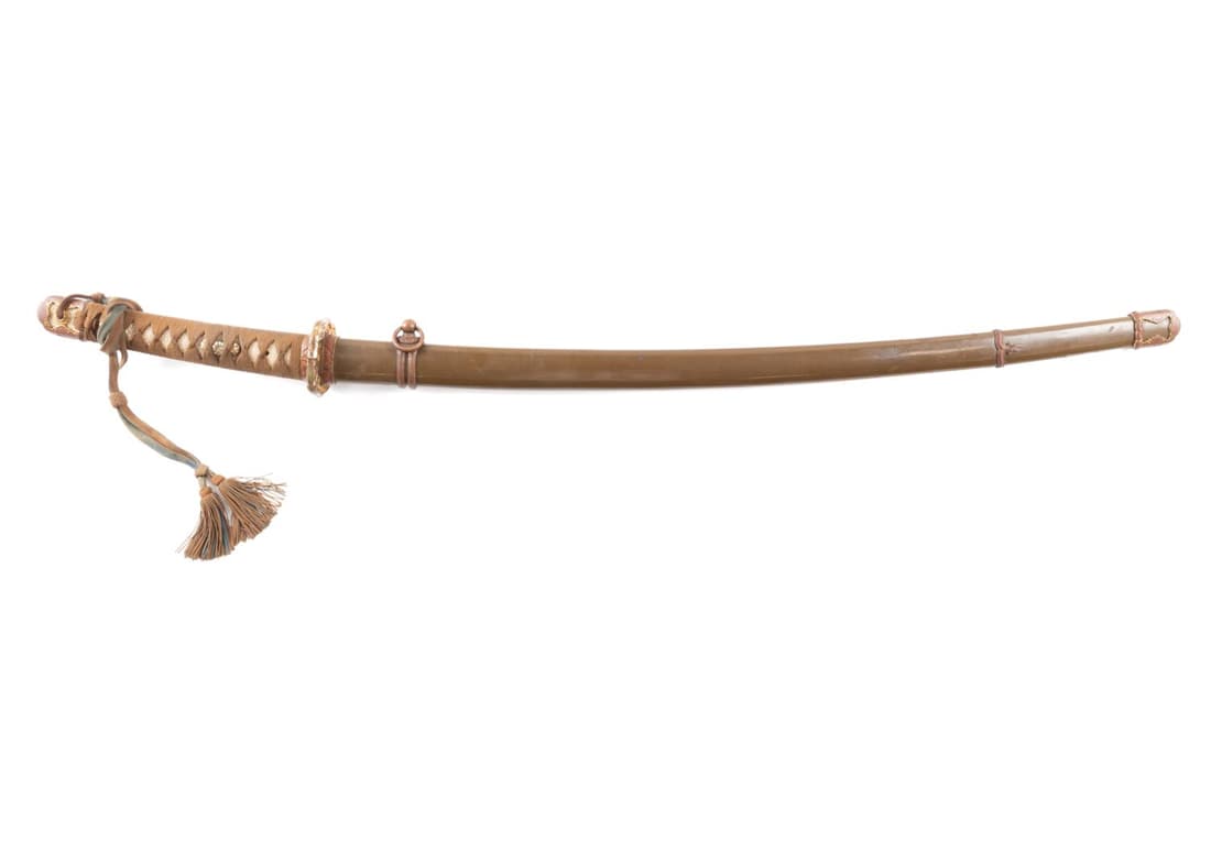 JAPANESE ARMY OFFICER'S SIGNED KATANA & SCABBARD: Signed Japanese officer's katana, early 20th century, having a Japanese officer's mount with a tassel on the handle, signed by Koaishin Mantetsuskukore,, blade being the Shoa period date range of 1930