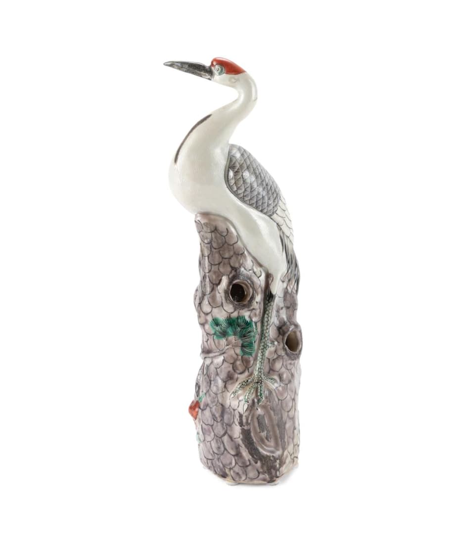 CHINESE CERAMIC CRANE STANDING ON ROCKWORK: Chinese ceramic figure of a red-crowned crane standing on reticulated rockwork with pine branches and lingzhi below, the crane and pine both denote long life, the crane and the lingzhi are symbols of 