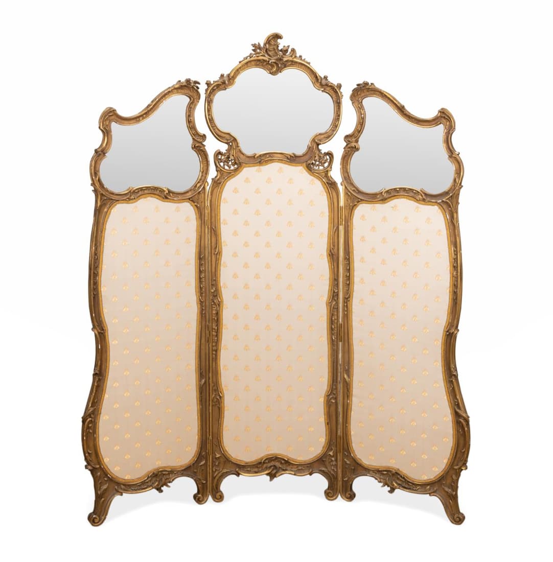 LOUIS XV STYLE GILTWOOD DRESSING SCREEN: Continental giltwood dressing screen in the Louis XV Rococo taste, having three shaped beveled glass panels above three upholstered panels,with no apparent marks. Approximate measurements: h. 18", w. 