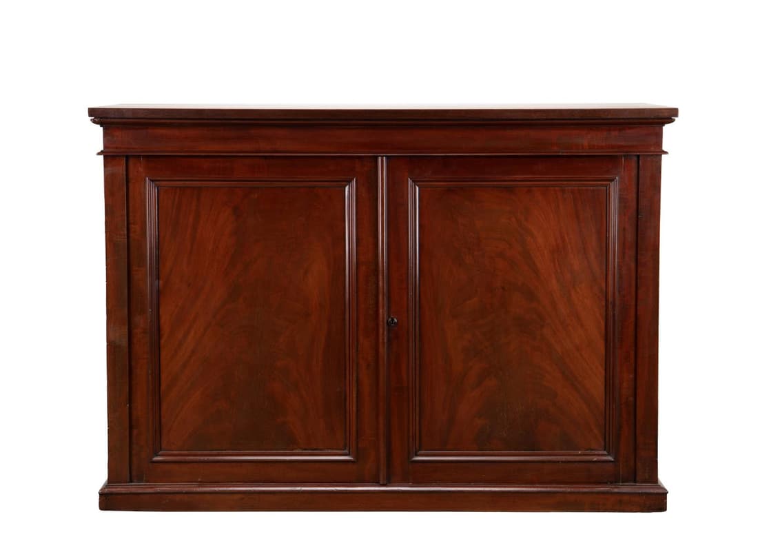 ENGLISH GEORGIAN STYLE MAHOGANY BUREAU CABINET: English Georgian style flame mahogany side cabinet, late 19th / early 20th century, having two paneled doors, opening to an interior fitted with drawers, rising on plinth foot, having no apparent make