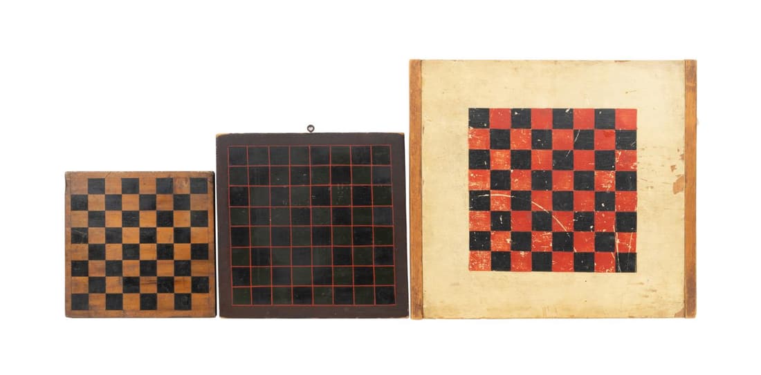 THREE 19TH/20TH C. PAINTED CHECKERS/CHESS BOARDS: Group of three American paint decorated folk art wooden checkers or chess game boards, 19th/20th century, of various sizes, two with a Morabaraba or cowboy checkers board, one retaining a Pook & Pook 