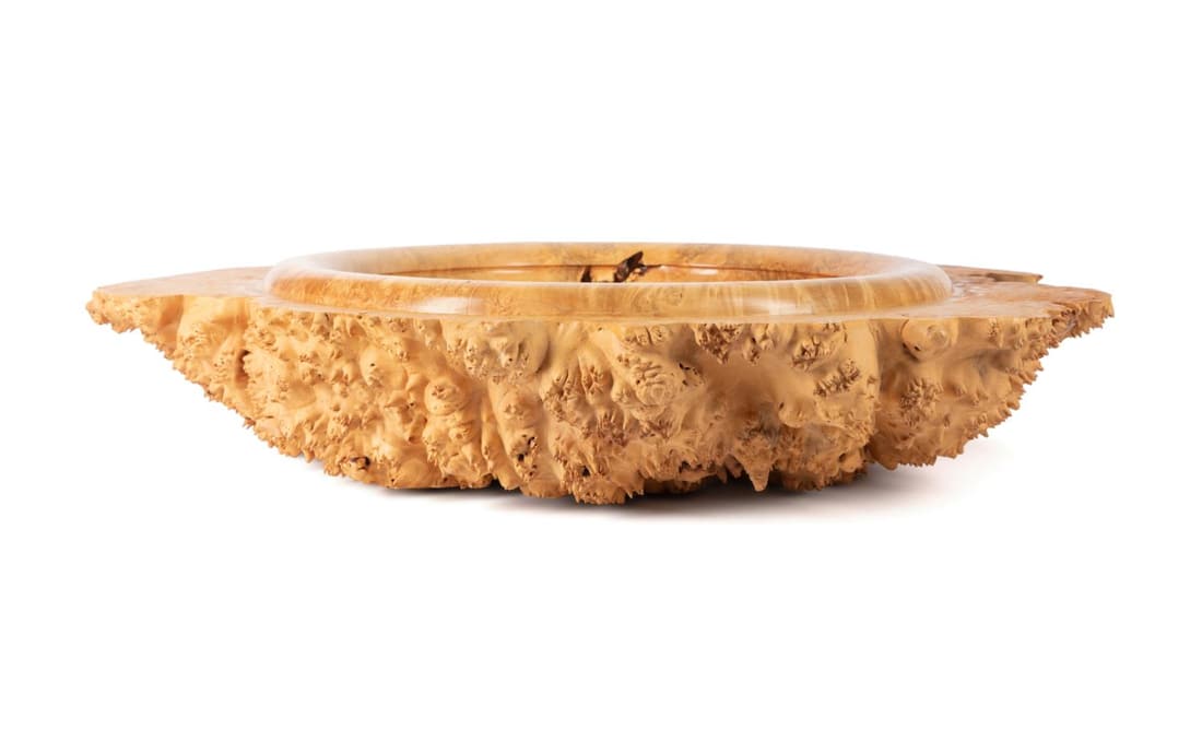 BOBBY PHILLIPS BIG LEAF MAPLE BURL BOWL: Bobby Phillips (American/NC late 20th century), Big Leaf Maple Burl bowl, having a live edge and underside, the top having a smooth bowl form depression, signed and titled underneath. Approximate meas