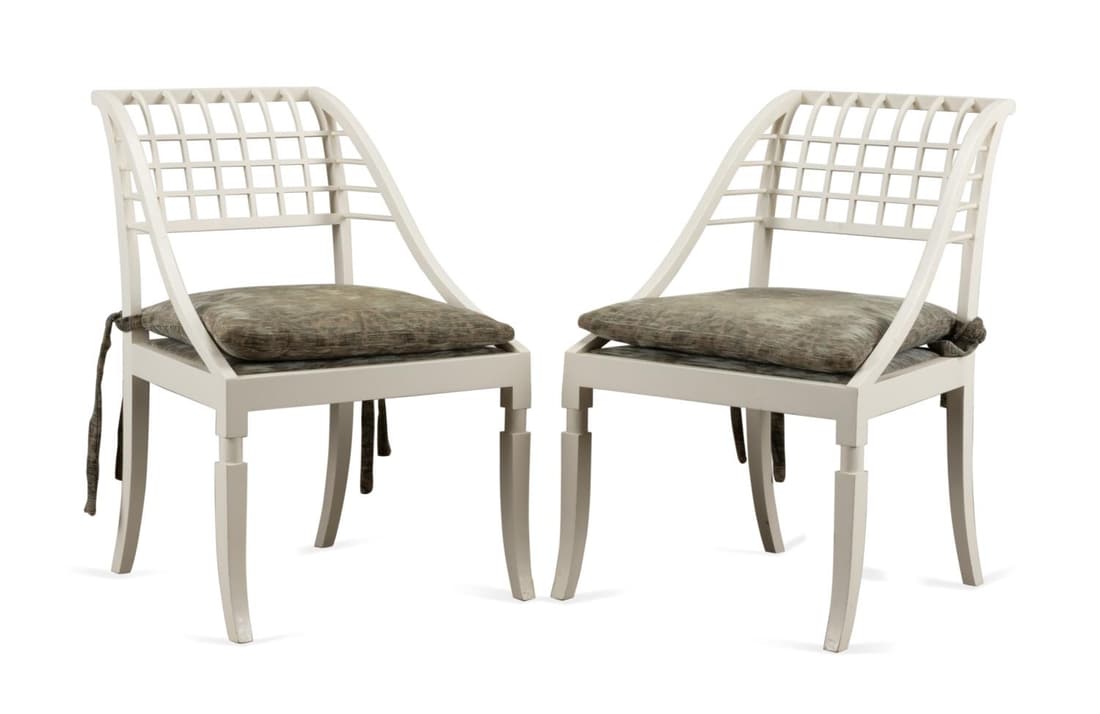 PAIR JOHN SALADINO "SLEIGH" ARMCHAIRS: Pair of John Saladino/Saladino Furniture Inc. (American 1986), "Sleigh" armchairs, each having a white lacquered maple frame, lattice back, loose seat cushion, and rising on sabre legs, with a label t