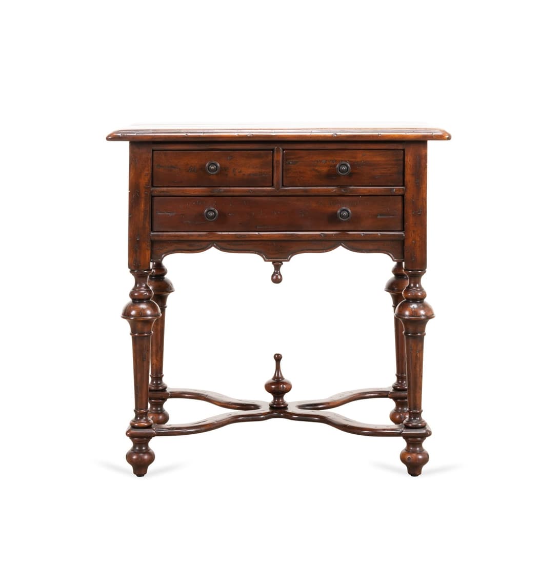 THEODORE ALEXANDER CASTLE BROMWICH END TABLE: Theodore Alexander Castle Bromwich collection mahogany end table in the William and Mary taste, having a distressed surface, three drawers, and rising on turned trumpet form legs with stretcher, manuf