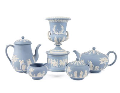 5PCS MAINLY WEDGWOOD JASPERWARE TABLE ARTICLES: Five pieces of mainly Wedgwood (English 1759), lavender,/light blue Jasperware table articles decorated with Classical scenes comprising, a Wedgwood teapot, covered sugar bowl, and cream jug, an unmar