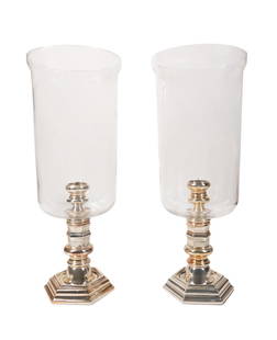 PAIR RALPH LAUREN SILVERPLATE AND GLASS HURRICANES: Pair of Ralph Lauren candle hurricanes having colorless glass shades on turned silverplate bases, with manufacturer's plaques to the front of each. Approximate dimensions: overall h. 20", dia. 8".