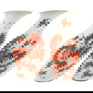 PAIR CHINESE IRON RED BUDDHIST GUARDIAN LION VASES: Pair of Chinese baluster form porcelain vases, each decorated with iron red Buddhist guardian lions and calligraphy characters, remnants of red wax export seals, and one vase with partial paper label