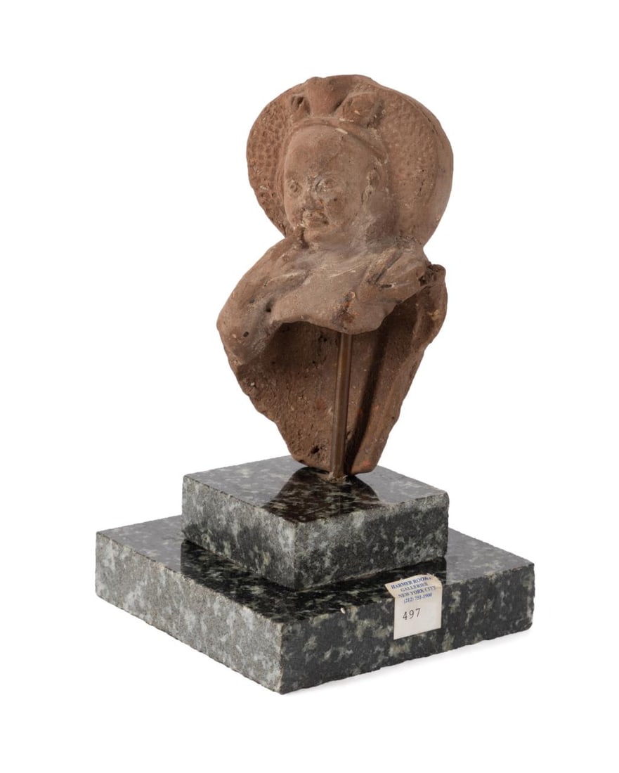 ROMAN STATUE FRAGMENT, DIVINE CHILD HARPOCRATES: Roman or Romo- Egyptian terracotta statue fragment of the divine child Harpocrates, the god of silence, circa 320AD, modeled with his finger just below his closed lips, with a later custom granite sta