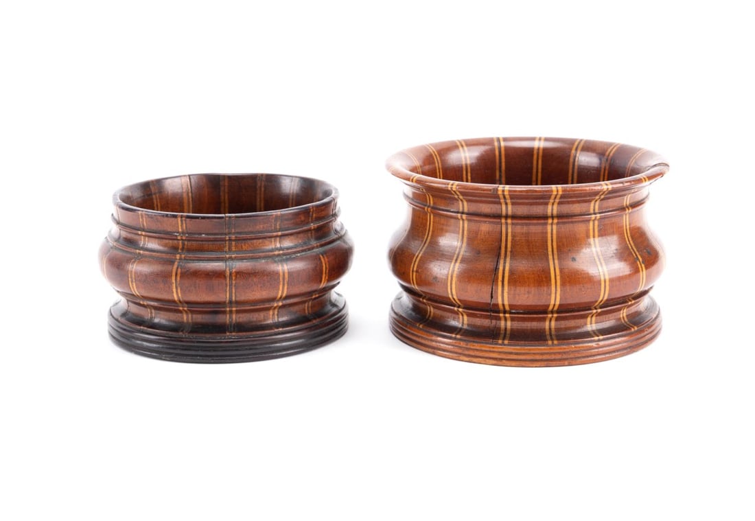 2PCS CONTINENTAL INLAID WOOD BOTTLE COASTERS: Continental string inlay and carved wood wine coasters, first half 20th century, decorated with painted castle scenes, apparently unmarked. Approximate dimensions: largest h. 2.75", diam. 4.5".