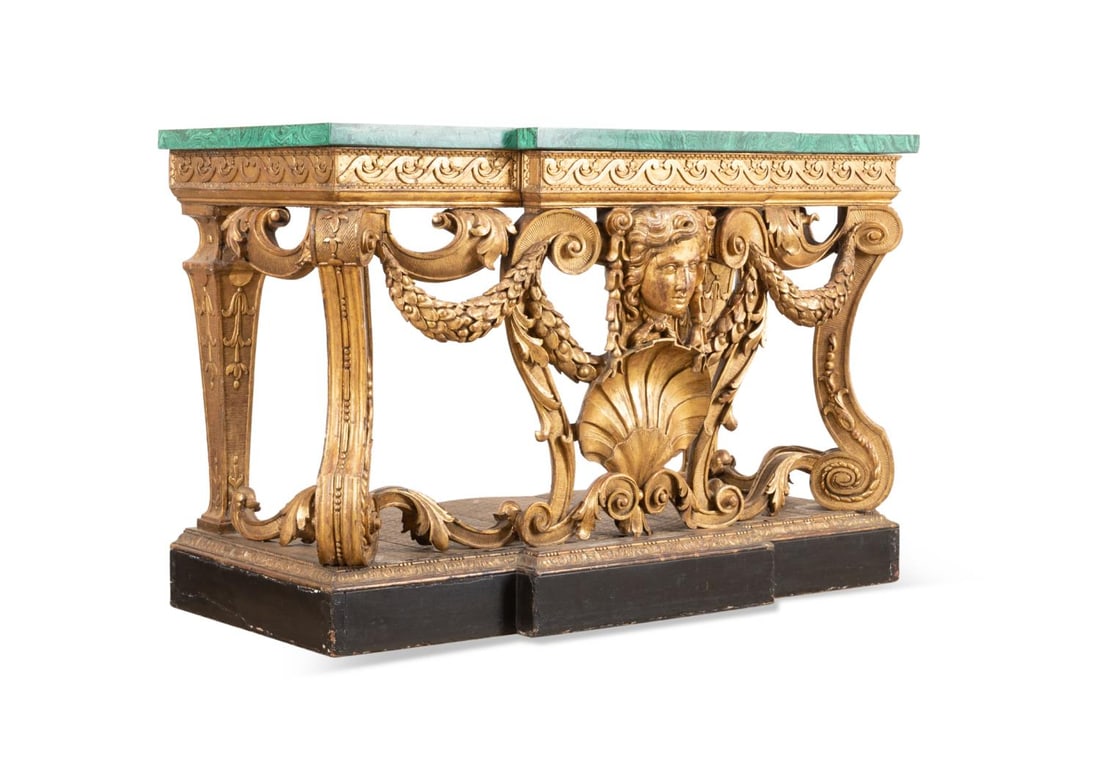 GEORGE III GILTWOOD FAUX MALACHITE TOP PIER TABLE: George III giltwood pier table in the manner of William Kent (English 1685-1748), 18th century, having a faux malachite patterned plaster top, Vitruvian scroll frieze supported by front scrolled legs