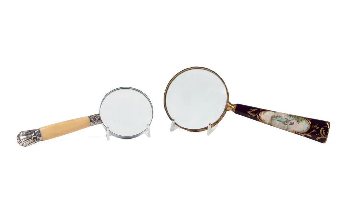 TWO MAGNIFYING GLASSES, BONE & PAINTED: Two magnifying glasses comprising, one with a Victorian sterling silver mounted bone handle, marks of Henry Greaves, Sheffield 1896, and one with a composite handle with raised gold detail and painted