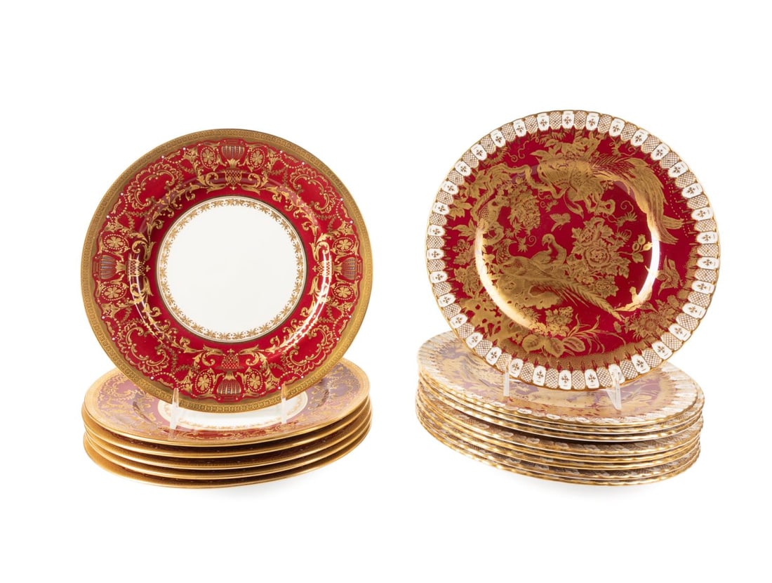 15PCS ROYAL CROWN DERBY & ROYAL DOULTON PLATES: Fifteen piece set of red gilded bone china dinnerware comprising nine Royal Crown Derby 'Paradise Maroon' dinner plates (pattern active 1965-1970; 10.5"), and six Royal Doulton encrusted dinner plates