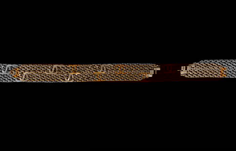 CHANEL BRONZE TONE METAL 'CC' CHOKER, 1997: Vintage Chanel link bronze tone metal choker, autumn 1997, having a 'CC' logo repeating pattern, with maker's mark and date to back of clasp link. Provenance: From The Estate of Vectra Orkin Barnette,