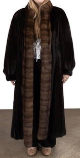 LADIES GIVENCHY MINK AND SABLE FUR COAT: Givenchy (French 1952), ladies mixed fur coat having a mink body with sable collar, double pockets, and hook and eye closures, label to the lining. Provenance: From the Private Collection of Tania Arm