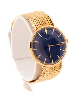 PATEK PHILIPPE 18K YELLOW GOLD CALATRAVA WATCH: Patek Philippe 18k yellow gold ‘Calatrava’ watch, featuring a winding jeweled movement, steel blue color dial with applied gold stick markers, acrylic crystal, on a tapering integral mesh band