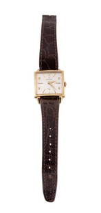 HAMILTON 14K YELLOW GOLD MASTERPIECE WRIST WATCH: Hamilton mid century modern 14k yellow gold 'Masterpiece' wrist watch, circa 1960, featuring a manual movement, champagne face, and dark brown leather band, with maker's mark, fineness, and 913470 to