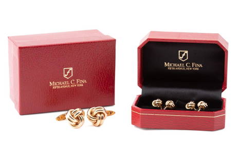 MICHAEL C. FINA 14K MEN'S ENDLESS KNOT DRESS SET: Michael C. Fina 14k yellow gold men's Endless Knot dress set comprising, four endless knot shirt studs and a pair of endless knot cufflinks en suite, marked 14k, in a fitted red leather box with an