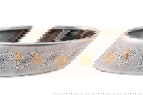 BUCCELLATI 'GEMINATO' STERLING & 18K CUFF BRACELET: Gianmaria Buccellati 'Geminato' 18k yellow gold and sterling silver cuff bracelet with engraved star motif, having a brushed finish and hinge to one side, with maker's mark, Italy, and 925 to interior