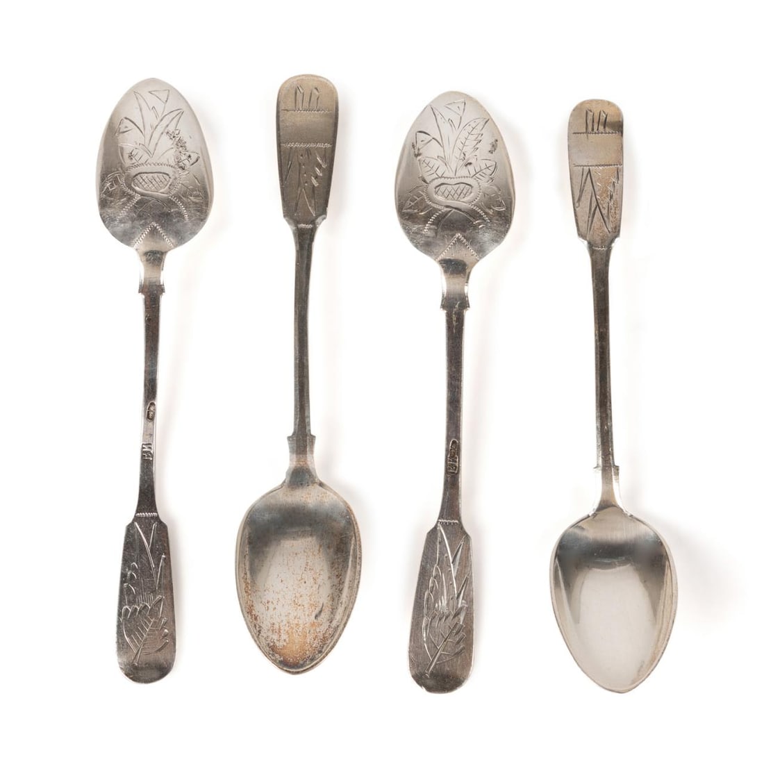 FOUR NICHOLAS II 84 SILVER CHASED DEMITASSE SPOONS: Four Russian Nicholas II, Ivan Kuzmich Yashin (Moscow) 84 zolotnik silver demitasse spoons, 1884-1897, having chased foliate decoration to back of bowl and handle, marked with city and maker's mark. P