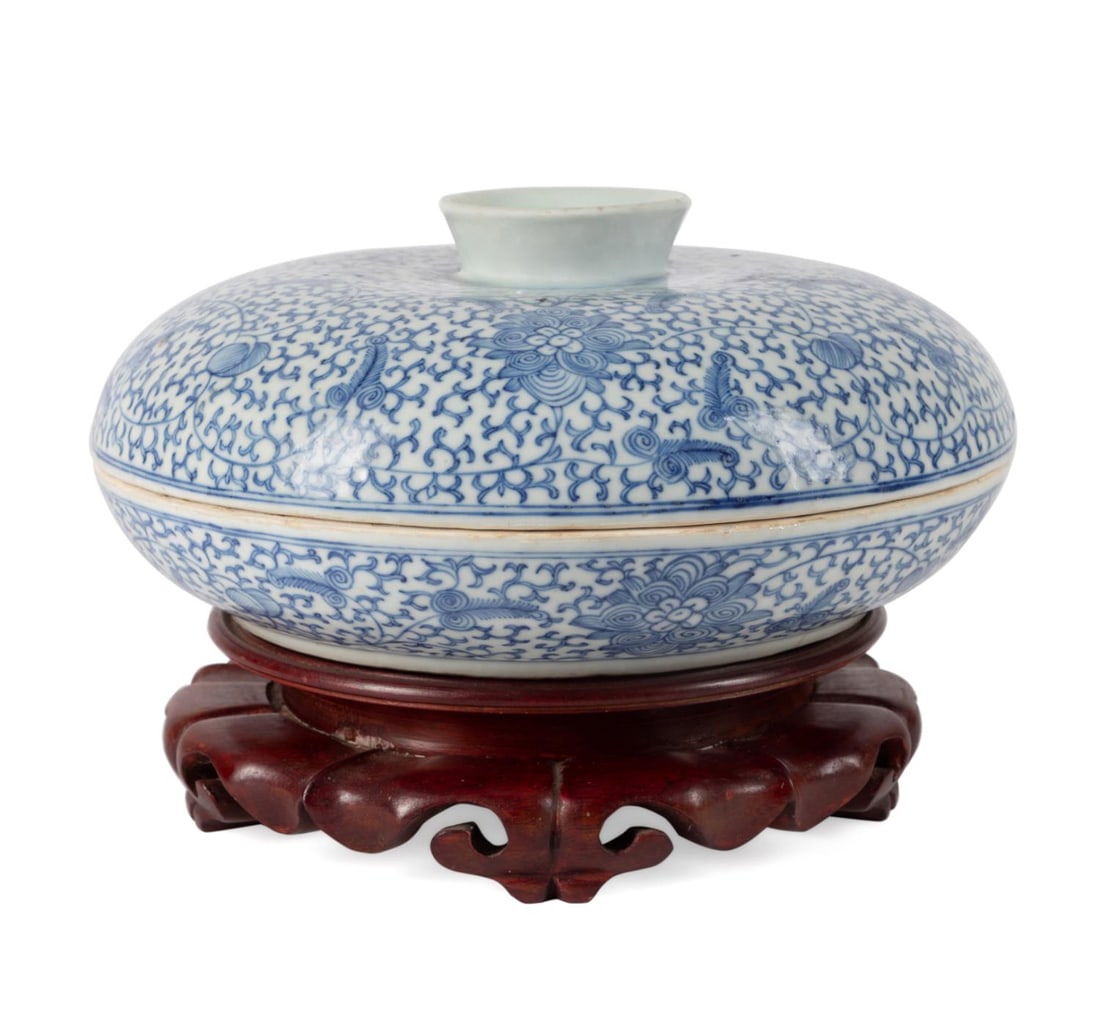 CHINESE BLUE & WHITE SWEETMEAT DISH W/ STAND: Chinese blue and white covered sweetmeat dish, the exterior decorated with lotus scrollwork and peaches, with a lid that can be flipped over to use as a footed bowl, the sweetmeat dish divided into si