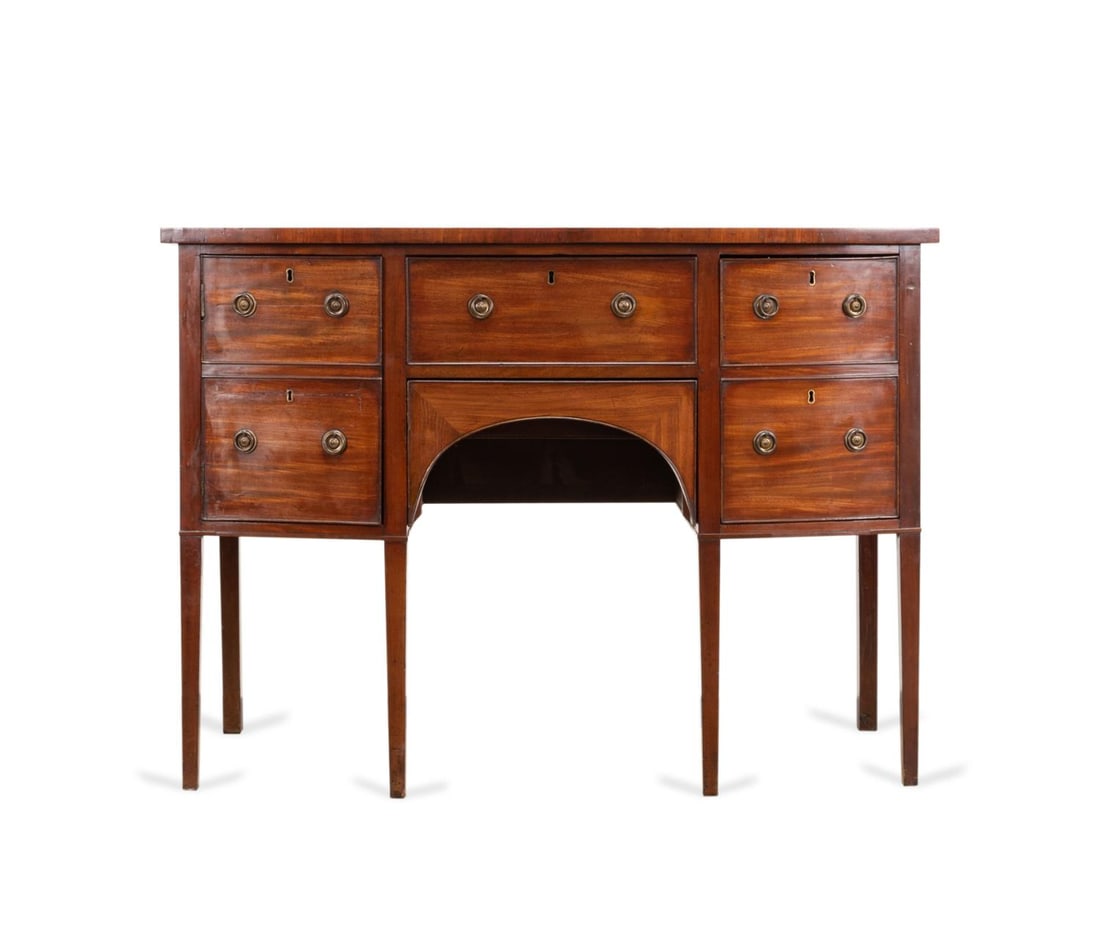 E 19TH C. GEORGE III DIMINUTIVE MAHOGANY SIDEBOARD: English George III mahogany Diminutive sideboard, early 19th century, having a shaped top over four drawers and two compartments, and raised on square tapered legs, apparently unmarked. Approximate di