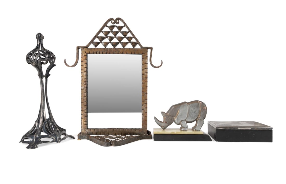 FOUR ART DECO INSPIRED DECORATIVE OBJECTS: Four Art Deco inspired decorative objects comprising, a spelter sculpture of a rhino with glass eyes, resting on an alabaster and marble base, an ebonized wooden cigarette box with a silver tone and b
