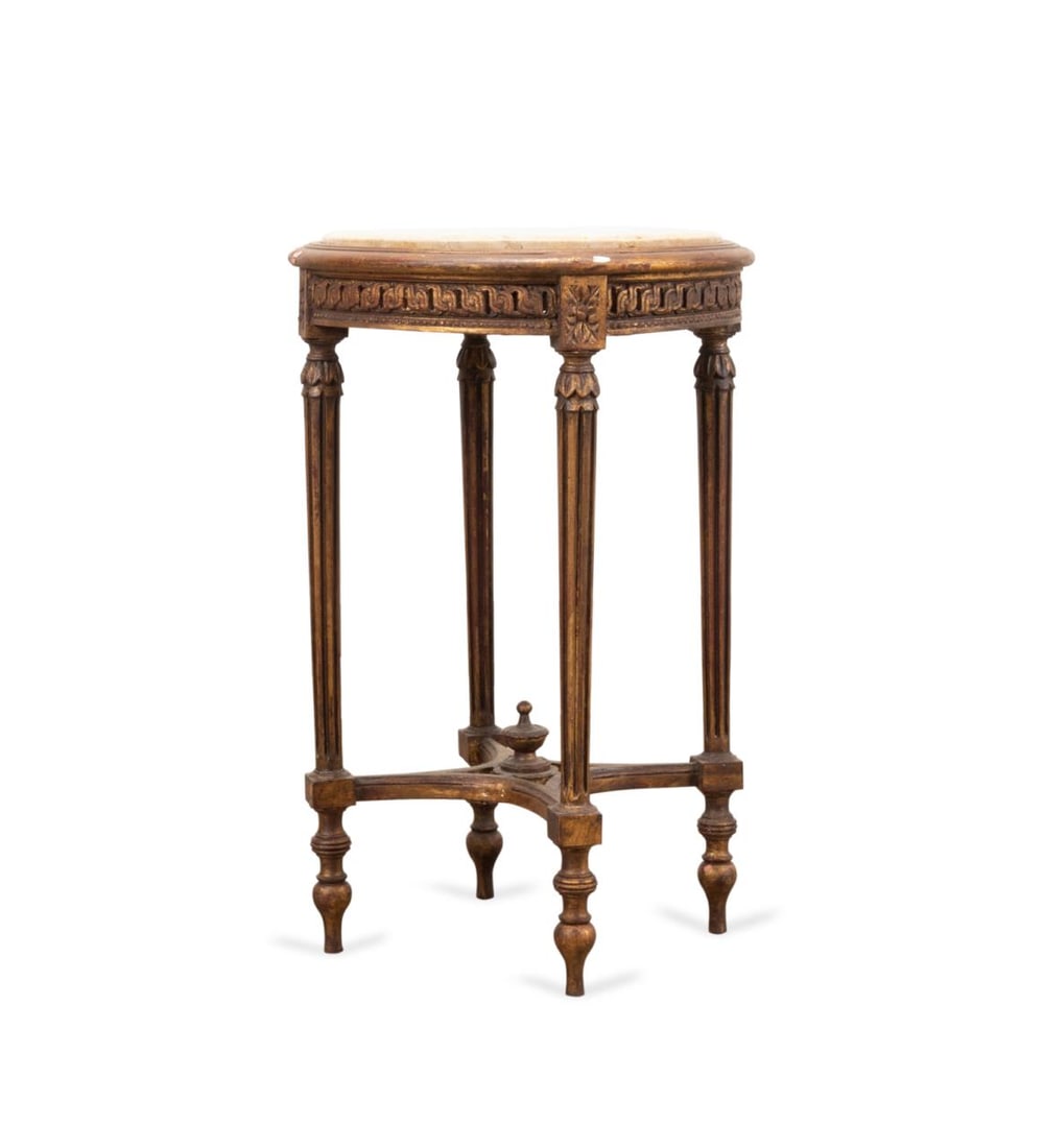 LOUIS XVI STYLE GILTWOOD TABLE W/ TRAVERTINE TOP: Louis XVI style giltwood table with a travertine top, 20th century, having a circular travertine top, inset into a wooden frame, resting on a carved and partially gilded base with tapering fluted legs