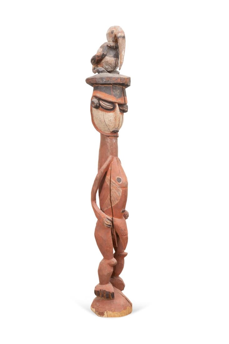 PAPUA POLYCHROME NGGWALNDU MAPRIK CARVING: Papua New Guinea, 20th century, Nggwalndu Maprik ancestor carving of a man with a hornbill on his head. Approximate dimensions: h. 43", w. 7.25" Provenance: The Collection of Jerome and Bridget Dobson