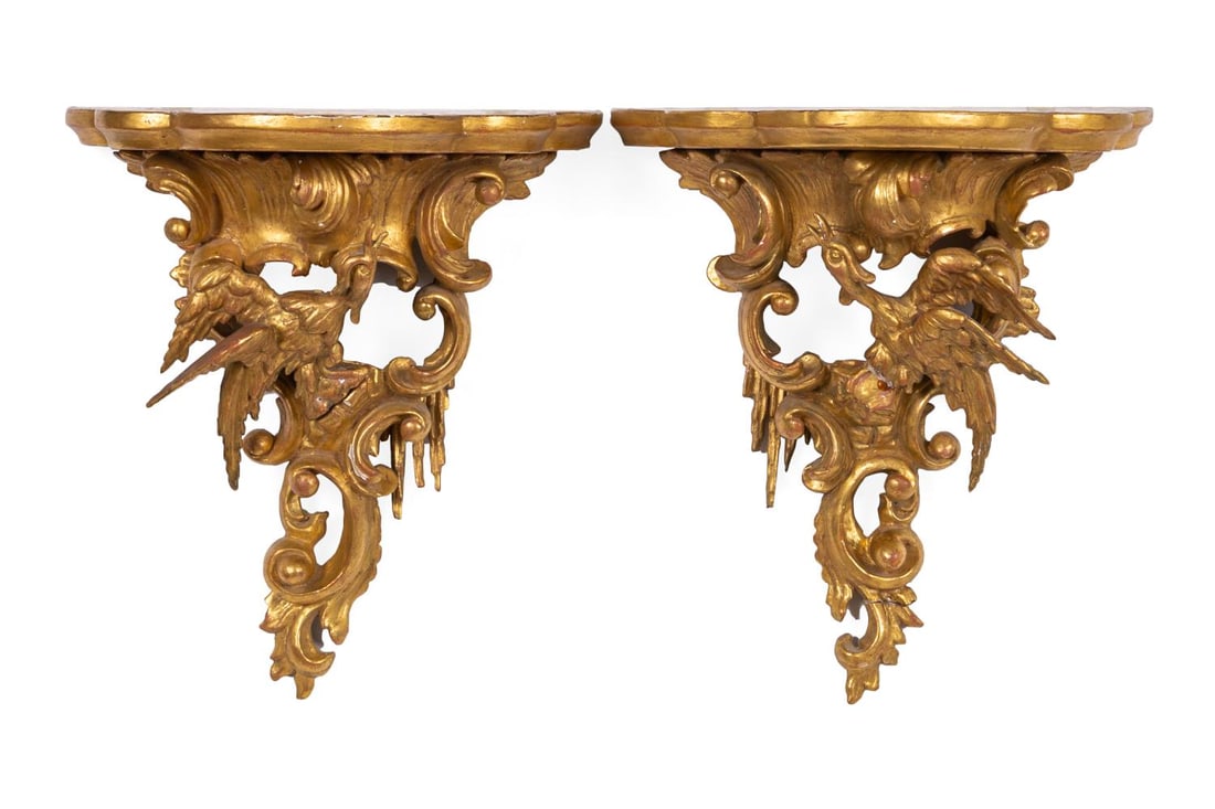 PAIR ENGLISH GILTWOOD PHOENIX BIRD BRACKETS: Pair of English 19th century giltwood brackets with a single phoenix bird over trailing icicles and c scrolls, topped with a five lobed ogee edged plank. Approximate dimensions: h. 15.5", w. 13.375",