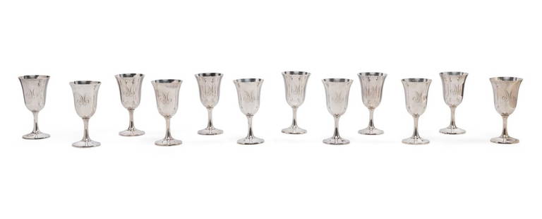 TWELVE WALLACE STERLING MONOGRAMMED WATER GOBLETS: Set of twelve Wallace Silversmiths (American 1871) sterling silver water goblets, pattern 14, each having an inverted bell bowl and rising on a domed foot, all marked appropriately. Approximate dimens