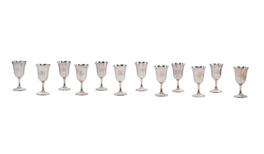 TWELVE WALLACE SILVERSMITHS STERLING WATER GOBLETS: Set of twelve Wallace Silversmiths (American 1871) sterling silver water goblets, pattern 14, each having an inverted bell bowl and rising on a domed foot, all marked appropriately. Approximate dimens